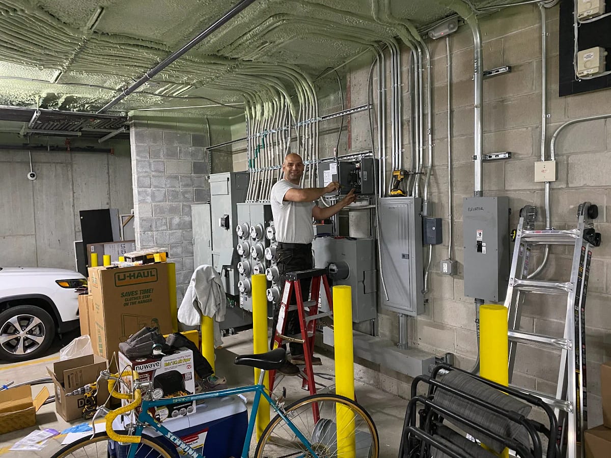 Electrician working a garage New Jersey Luminous llc