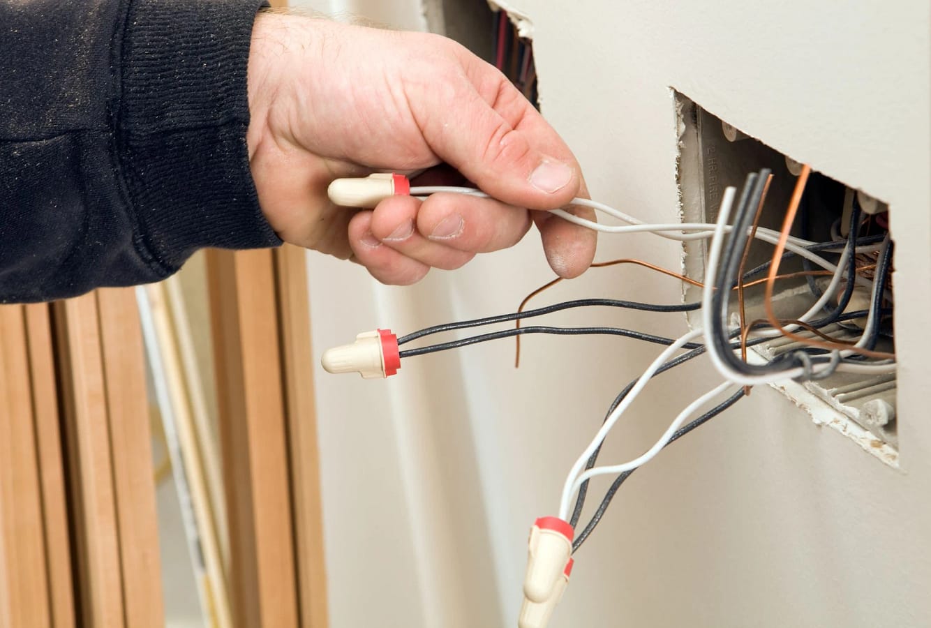 Electrician repairing electrical board Luminous llc