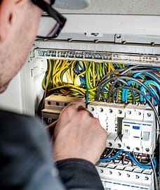 Electrician repairing electrical board Luminous llc