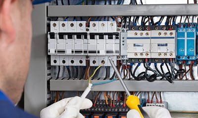 Electrician repairing electrical board Luminous llc