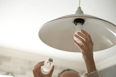 electrician working project light board Luminous llc